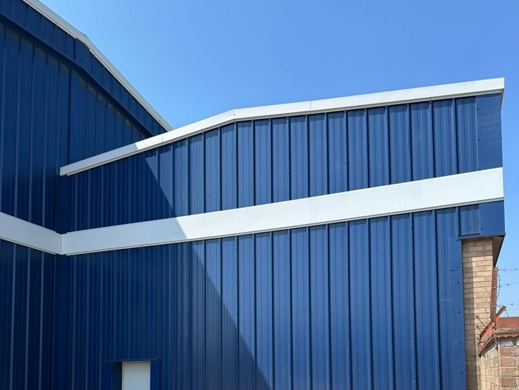 Segment of warehouse with cladding painted blue