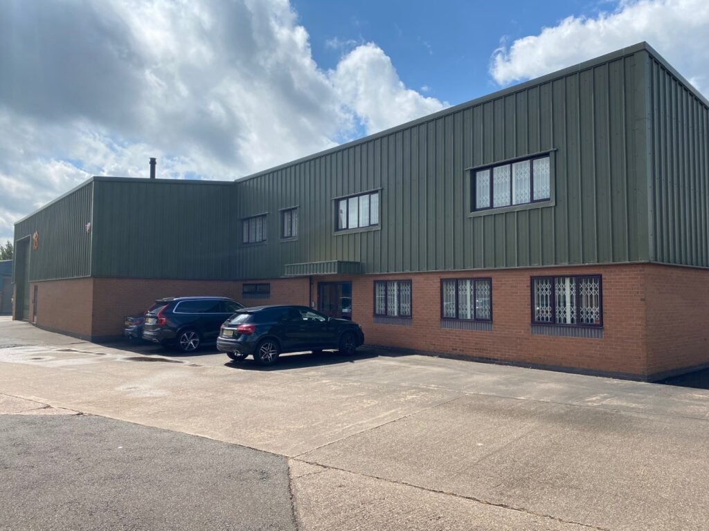 Exterior cladding of warehouse painted green