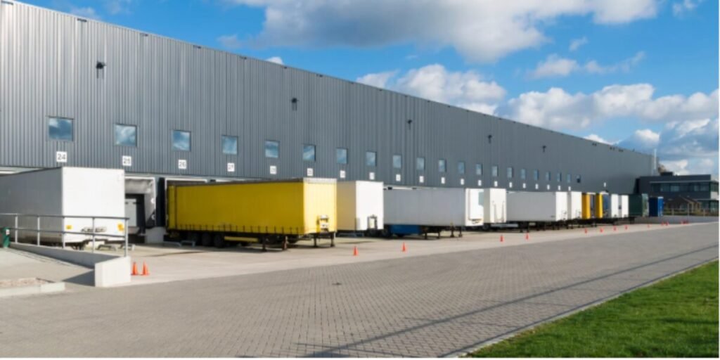 Professional Spray Painting a Warehouse 